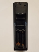 N2QAYB000008 Panasonic Audio System CD Tape Radio Remote Control rear view with rotating hinge battery door open